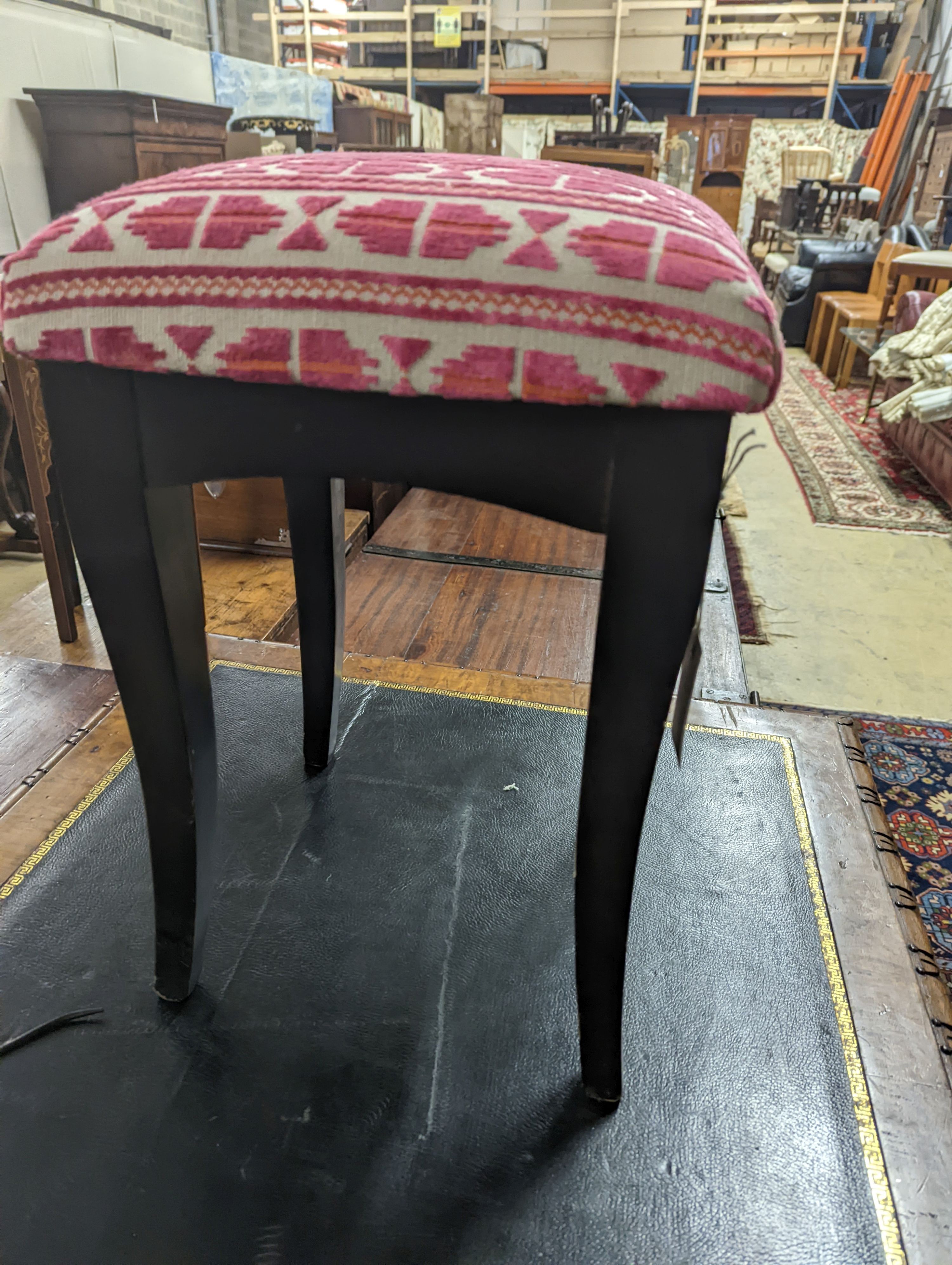 A square ebonised footstool upholstered in Andrew Martin fabric, width 32cm, height 50cm